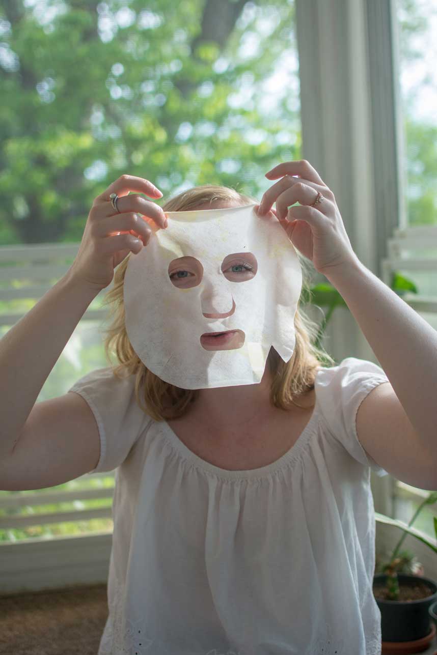 Woman making her own cannabis infused facial sheet mask at home