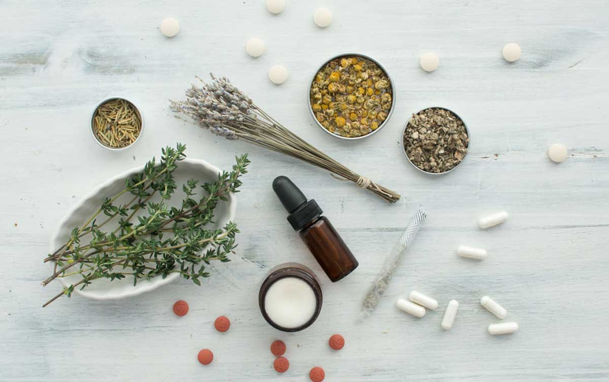 Natural herb supplements and products including dried herbs of lavender and chamomile, fresh thyme, capsules, tablets, tincture, balm