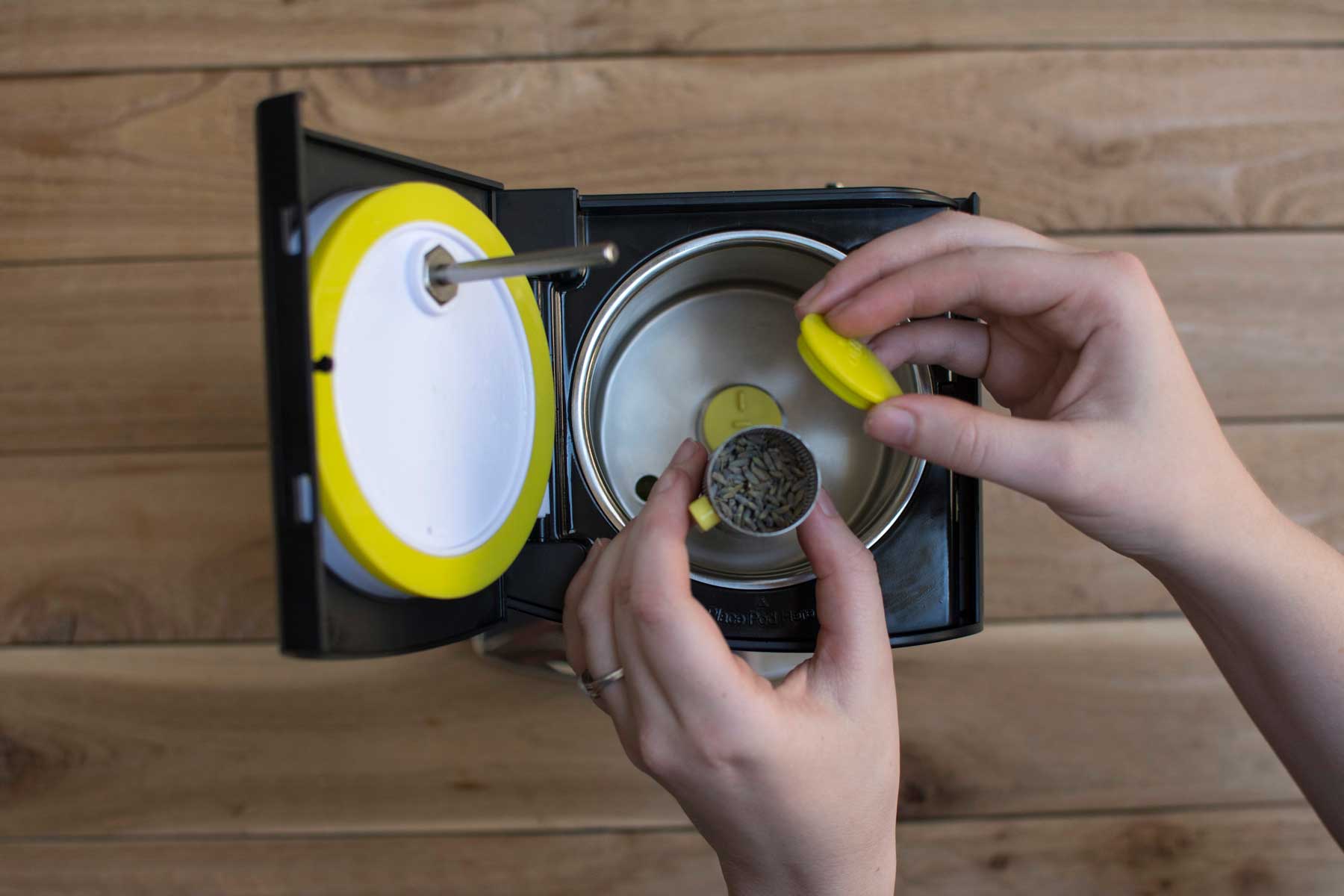 Adding herbs to the LEVO oil infusion machine herb pod