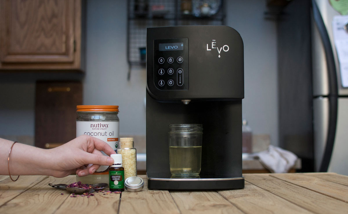 Ingredients for rose and eucalyptus cannabis infused lip balm with LEVO oil infusion machine