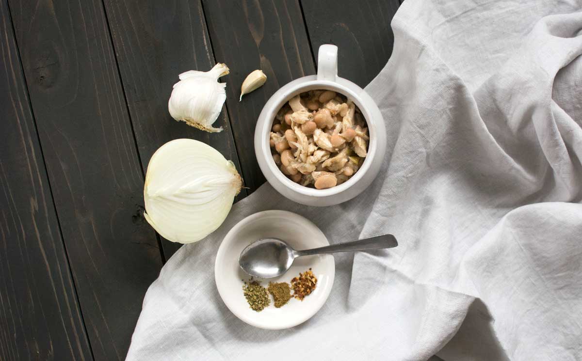 White bean and chicken chili recipe styled with onion and spices