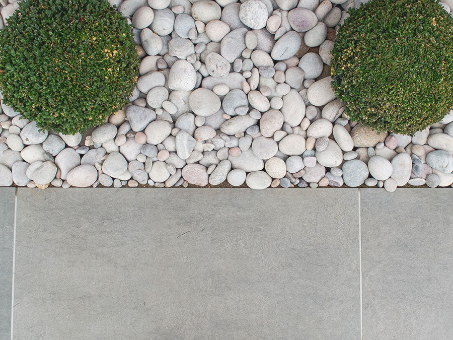 Grey cobbles pebbles grey porcelain paving