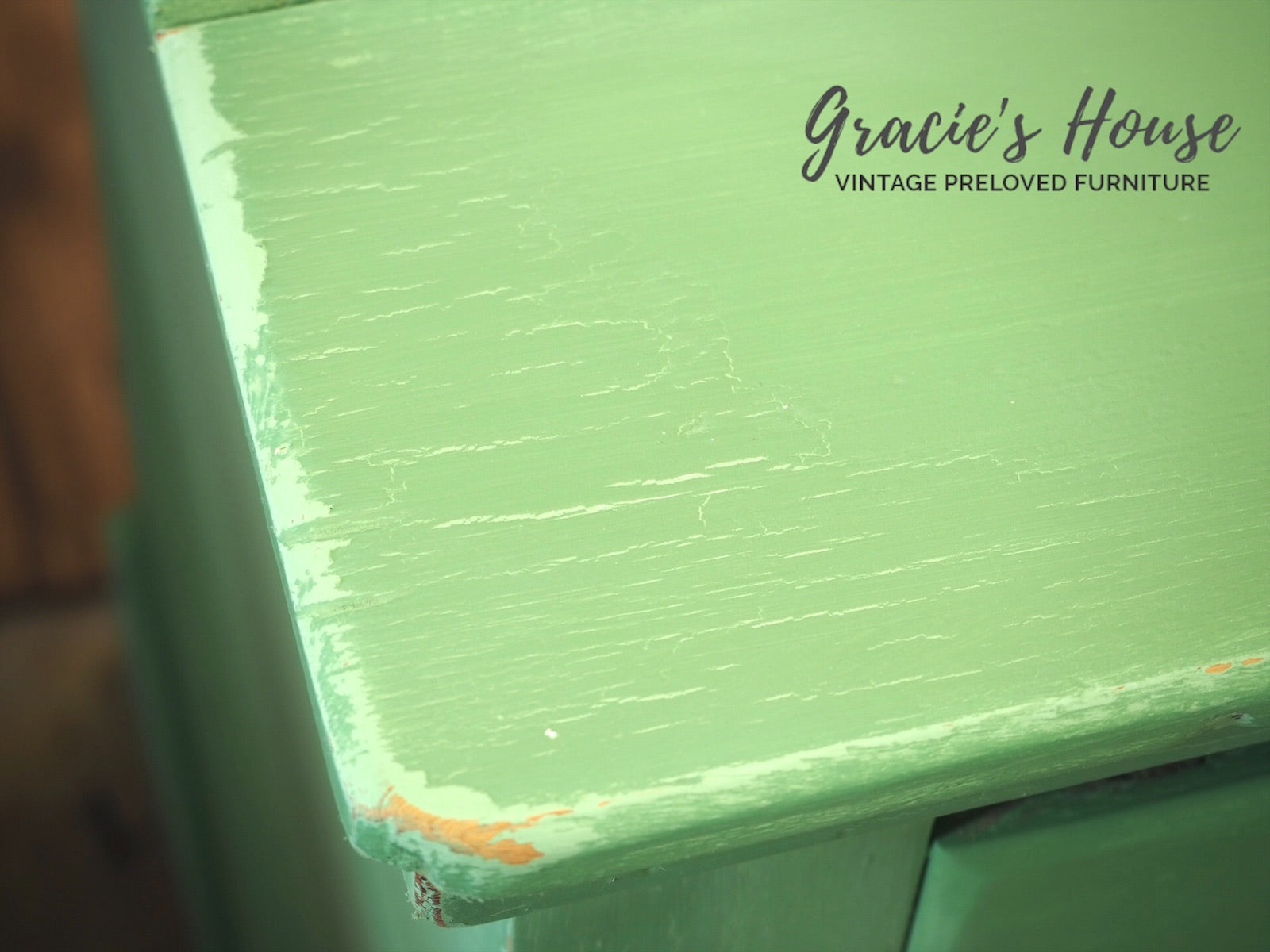 vintage green painted chest of drawers - close up - crackle