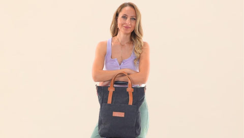 Woman holding a convertible bag - sustainable tote bags