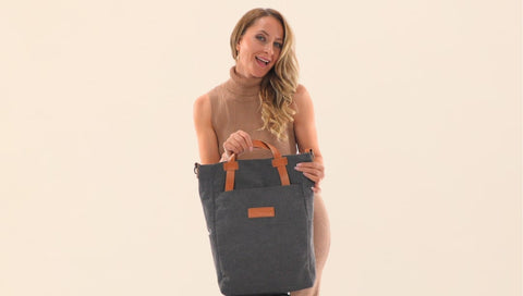 Woman holding a convertible bag - tote bag