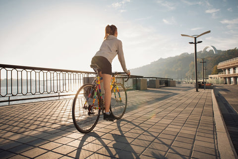 Woman strolling around with bicycle