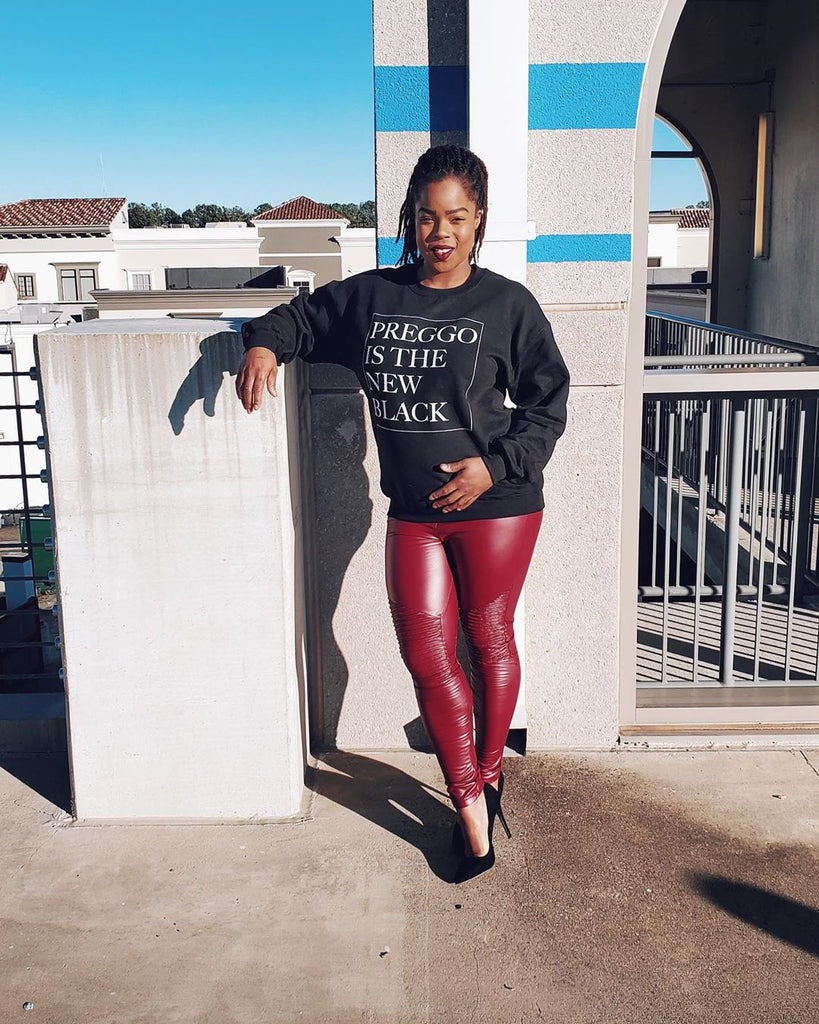 pregnant woman wearing red faux leather maternity leggings