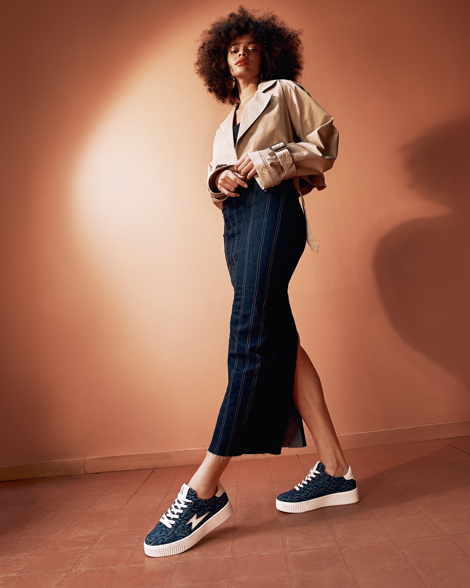 The Enola denim heart lace-up storm sneakers with a denim dress and a short trench coat