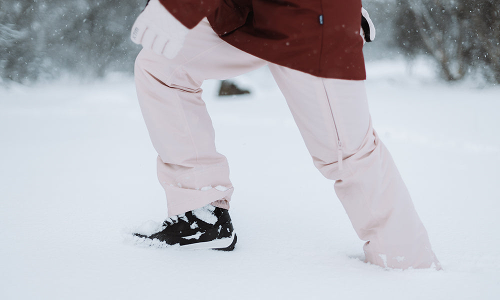 Woman walking in boot deep snow
