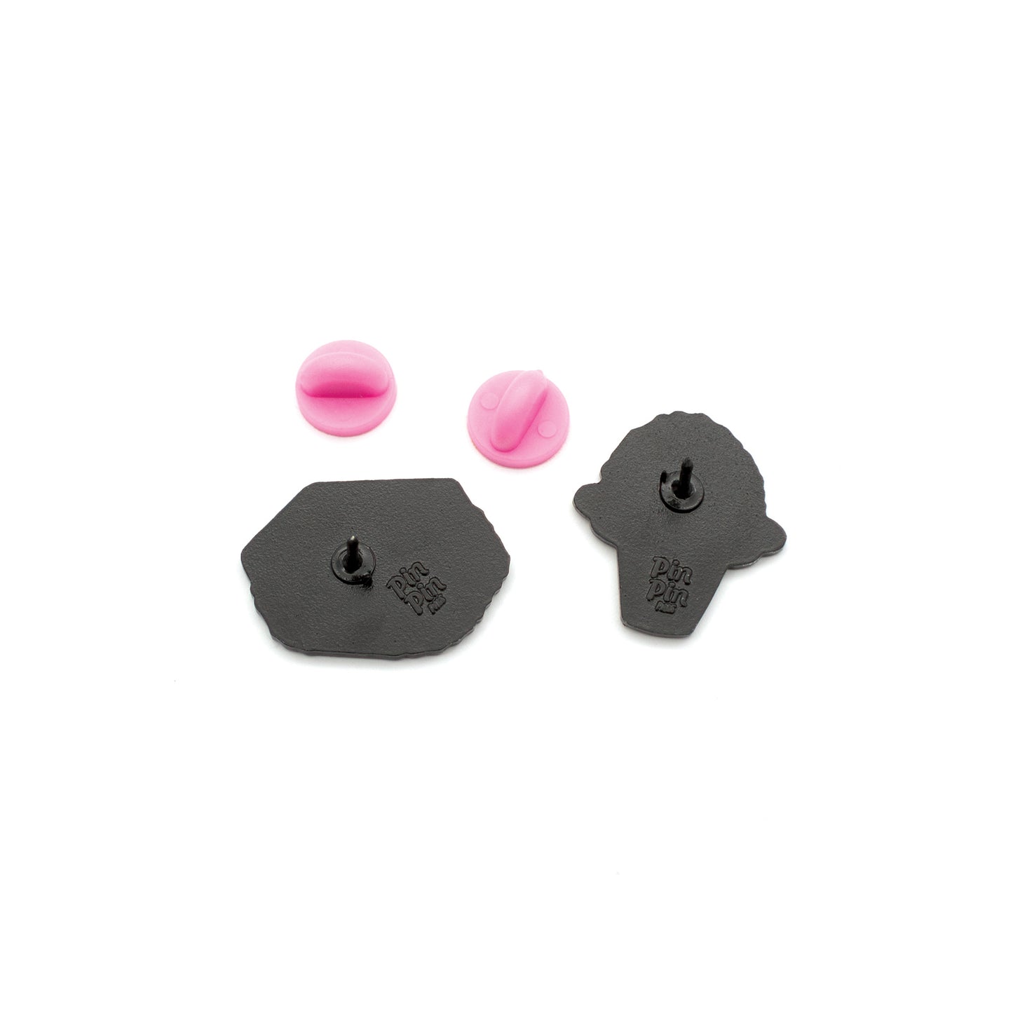 Backs of Spam Musubi and Shaved Ice enamel pins with pink rubber backings