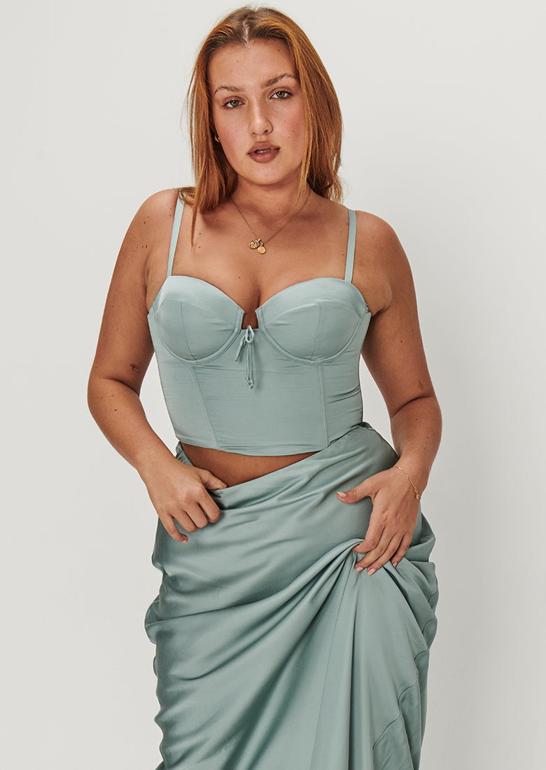 Elevate your style with Osa's metallic green and gold corset top