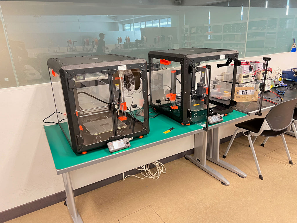 A pair of Prusa MK4s with enclosures