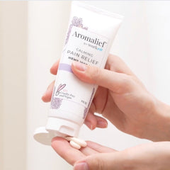 Aromalief Lavender Pain Relief Cream dispensed on hands before bedtime