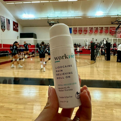Workvie Lidocaine Roll On Bottle at a Volleyball Game