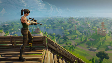 A Fortnite character at high ground looking down on the map