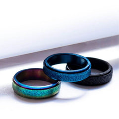 Blue, rainbow, black anxiety rings on a withe background