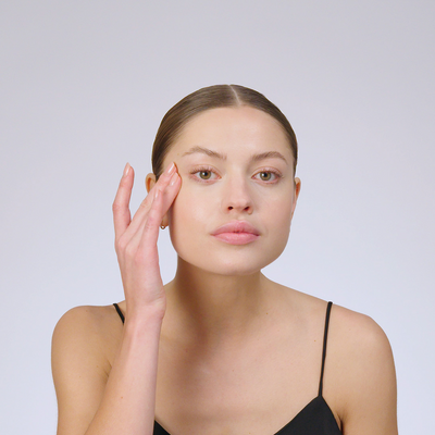 woman applying eye cream