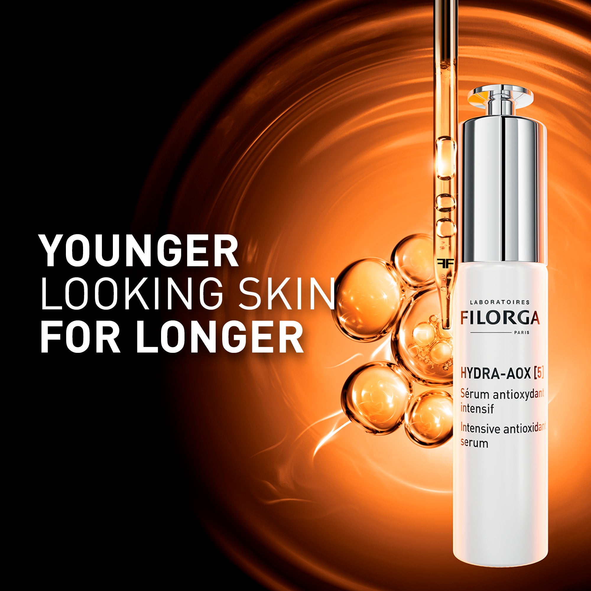 FILORGA HYDRA-AOX [5] - Younger looking skin for longer with bottle and dropper on orange background