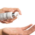 FILORGA AGE-PURIFY CLEAN dispensing green gel cleanser onto open palm of hand