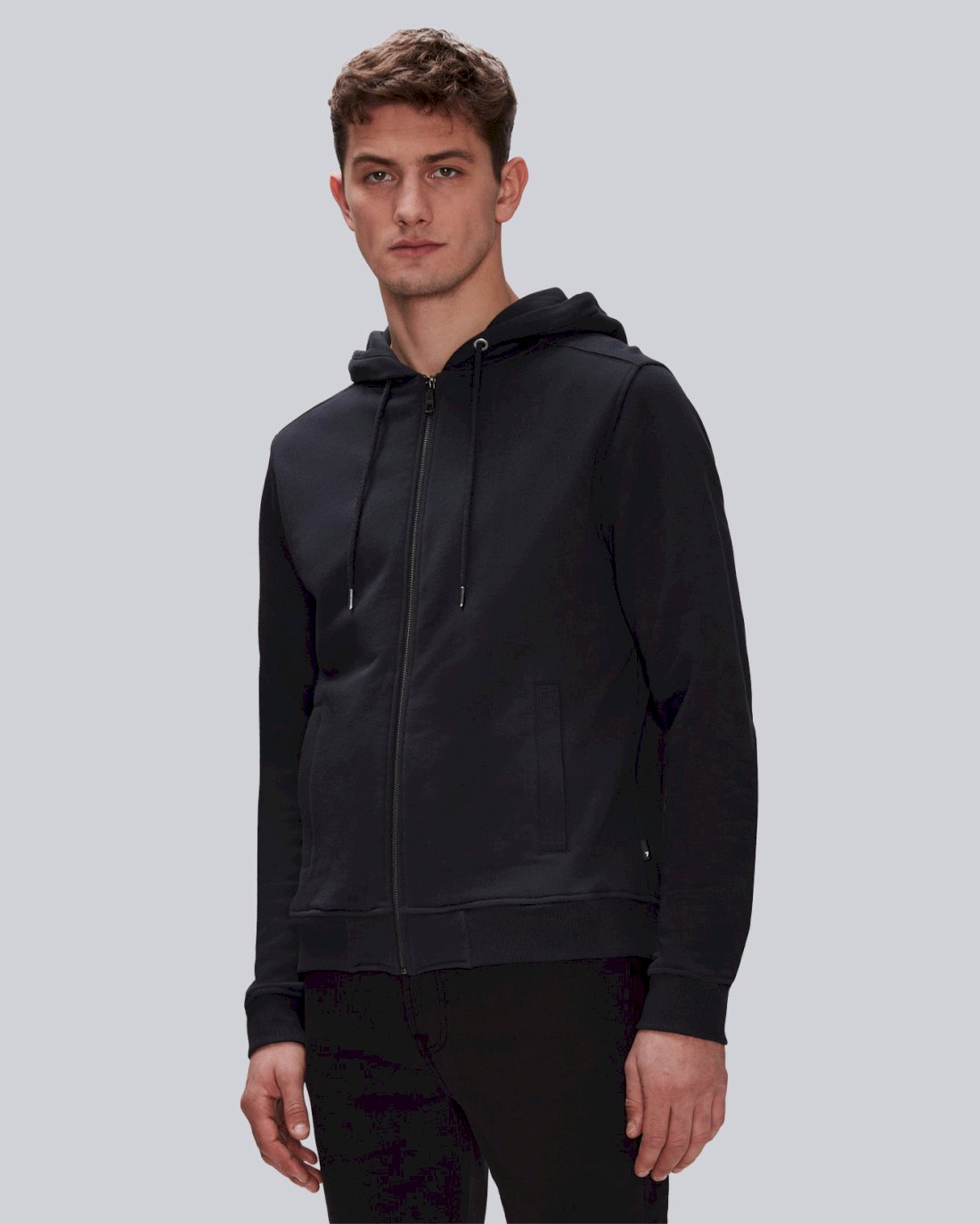 Basic, zip-up hoodie in faded black with two pockets and a