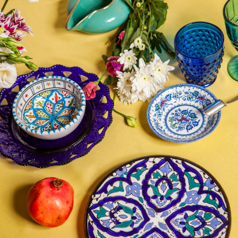 Tablescape with bright and vibrant hued serveware