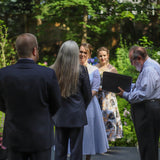 during the wedding service in the garden