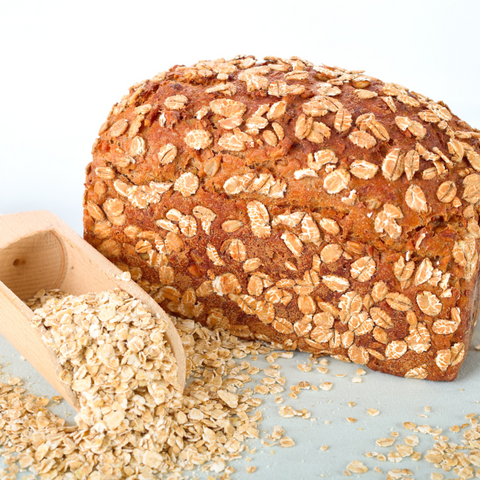 Oatmeal bread made with Born Reborn's Oats Muesli is presented on a table