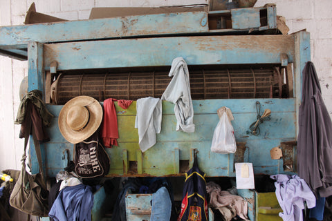 finca la bolsa hats and clothes in a changing room