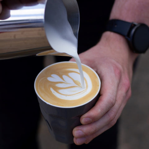 latte art being poured chimney fire coffee