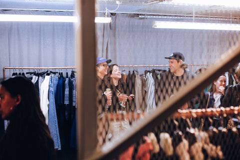 People standing in the POP Trading Company pop-up shop in London