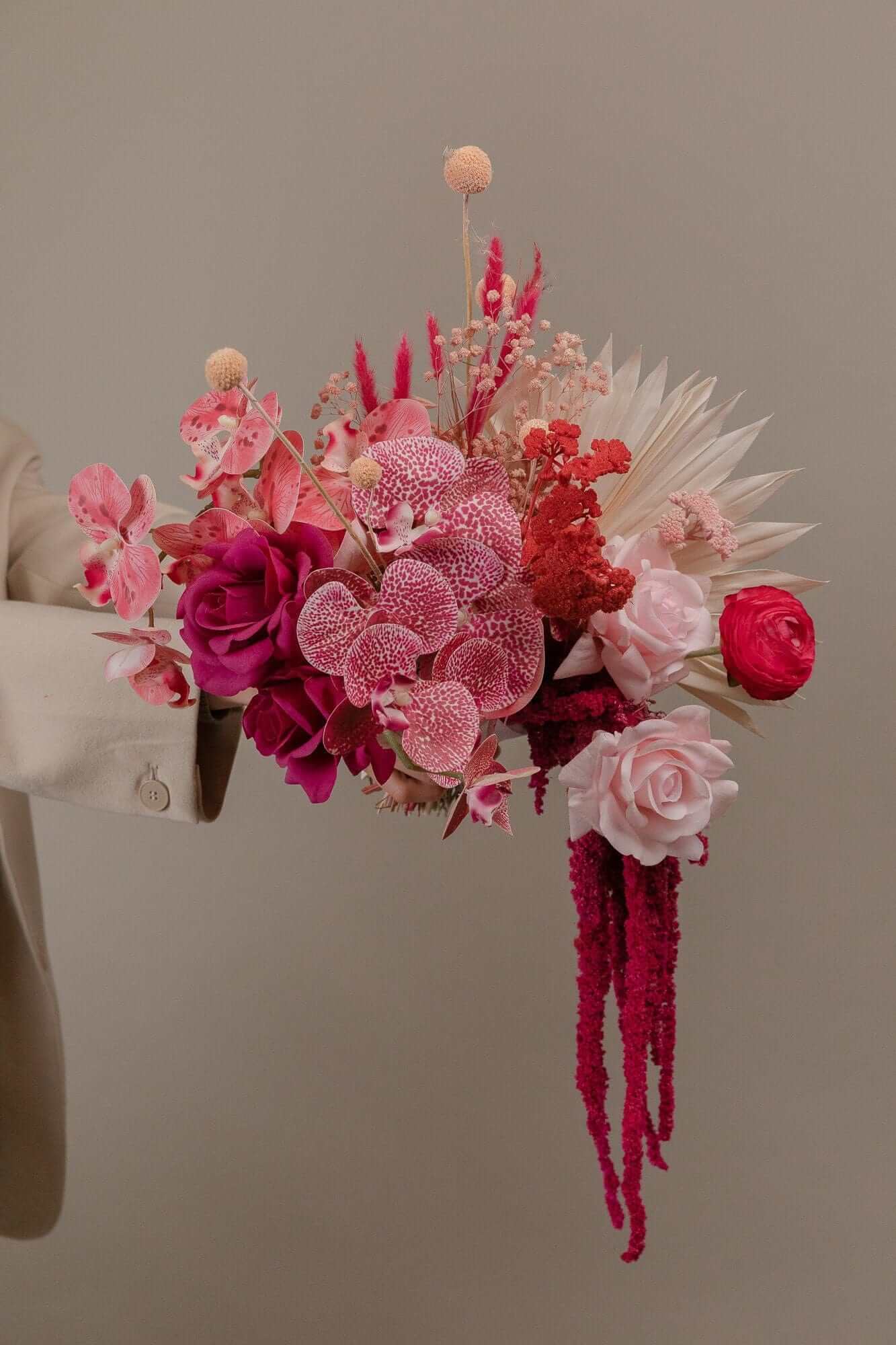 Hidden Botanics’ dried pink orchid wedding bouquet.
