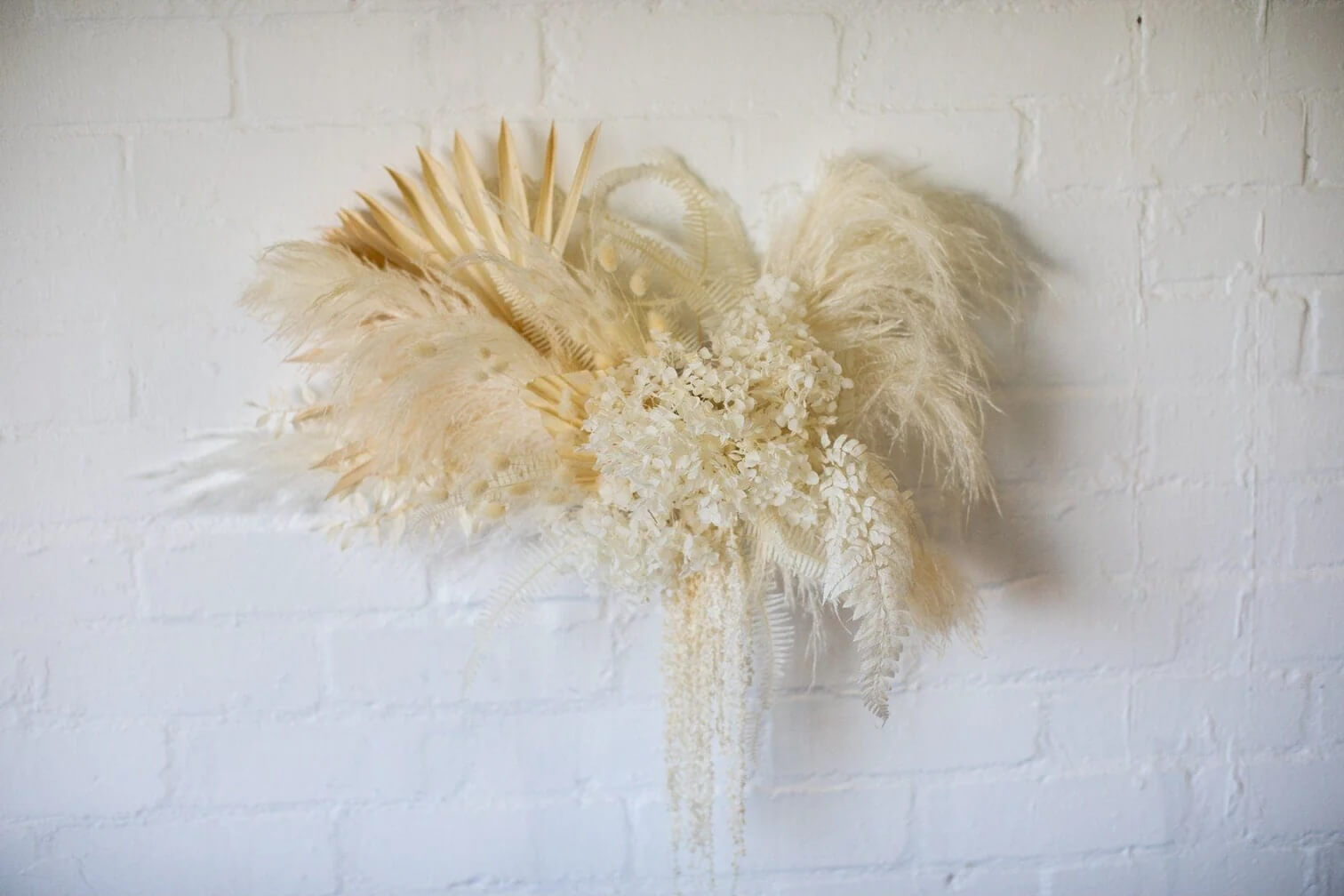 Trailing Amaranthus and Pampas Moongate dried floral wedding decor.