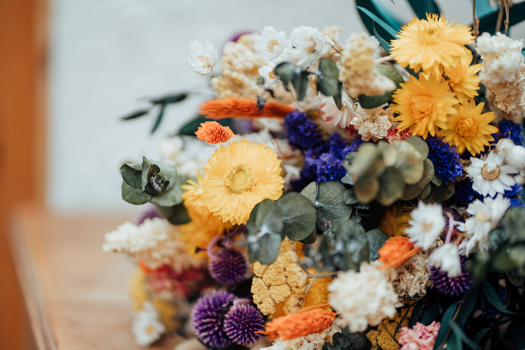 A close-up photo of a colorful bouquet with dried flowers by Hidden Botanics.