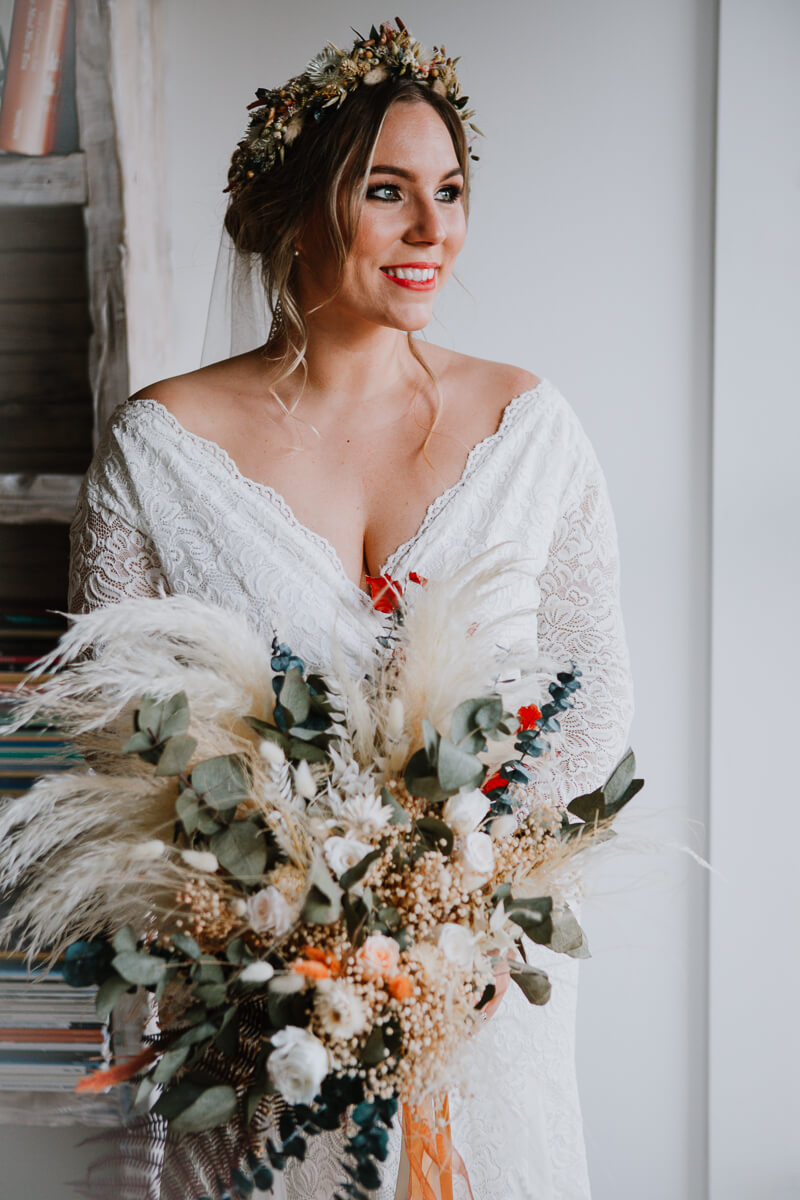 Bride wears Hidden Botanics’ flower crown with matching dried wildflower bouquet.