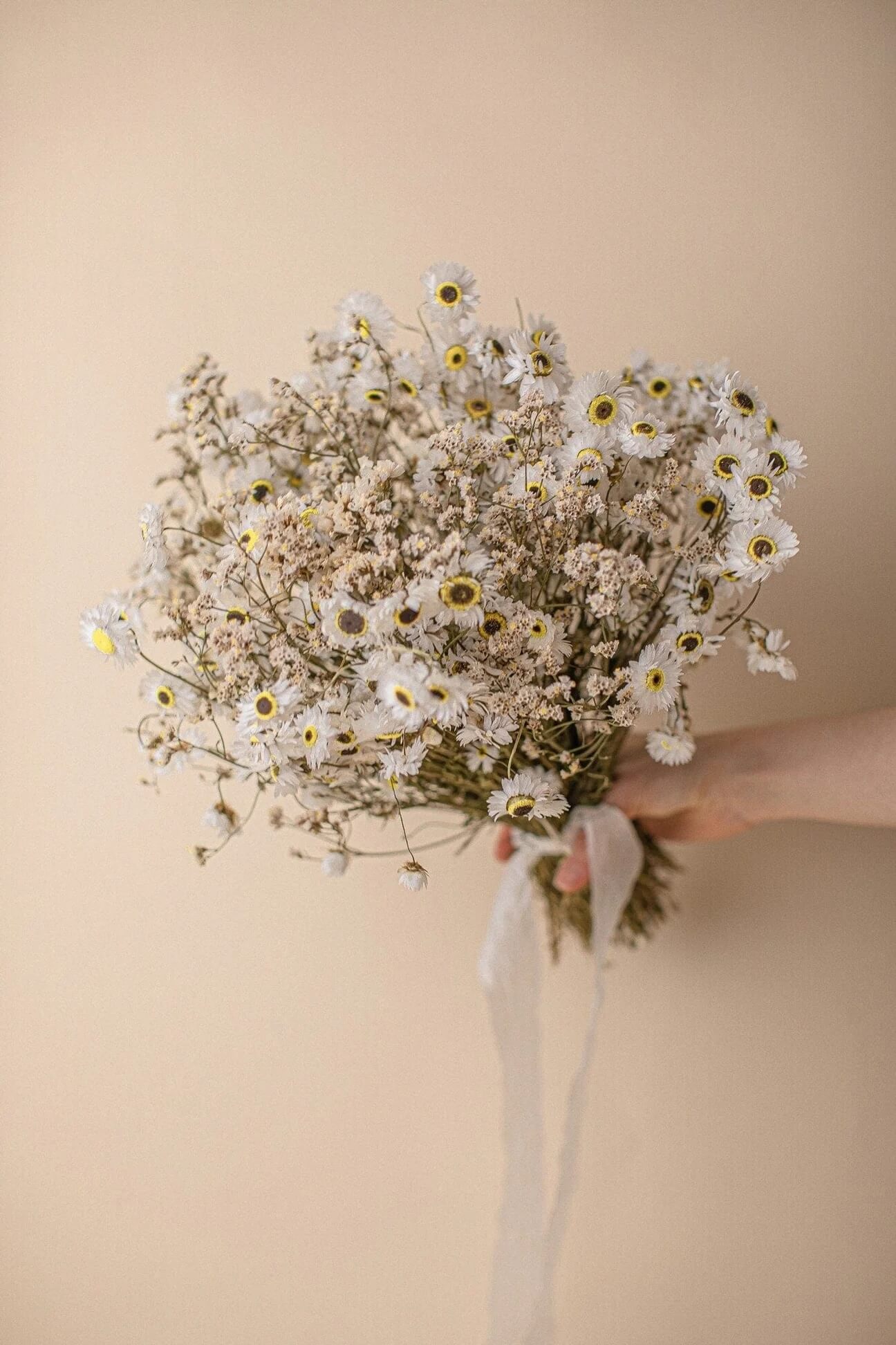 Hidden Botanics’ dried daisy wedding bouquet.