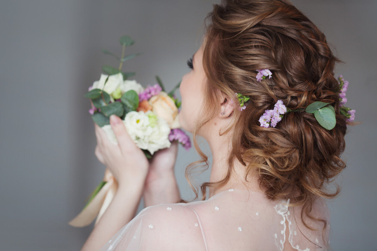 Vintage bride wedding hair with flowers.