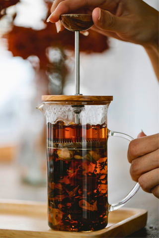 Loose leaf tea steeping in a french press