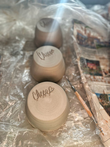 Signed ceramic pieces after being trimmed