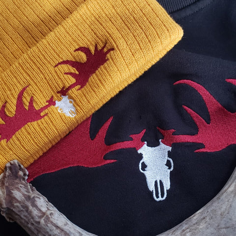 knit beanie and sweatshirt featuring the giant irish elk embroidery