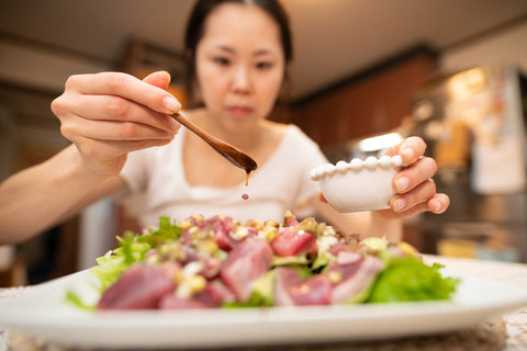 Woman cooking with ponzu sauce