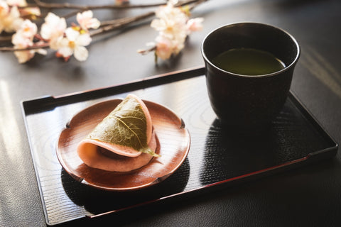 Cup of tea with traditional Japanese dessert