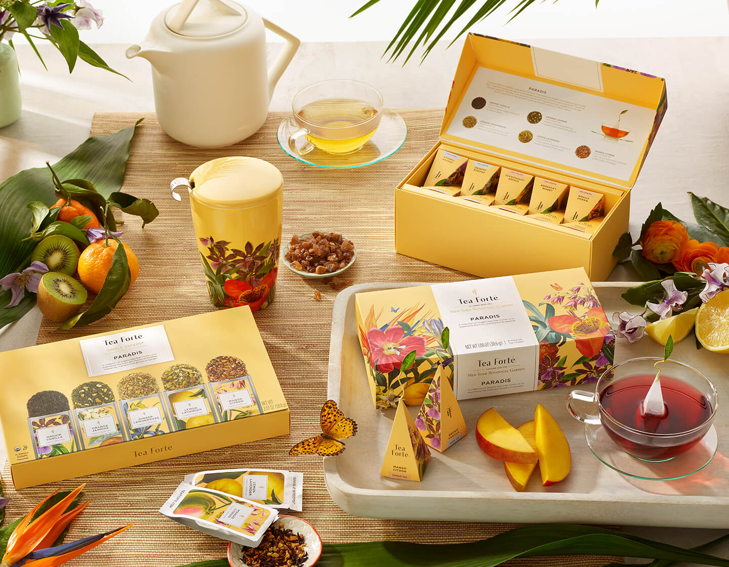 Paradis Collection boxes, infusers and glass cup of tea