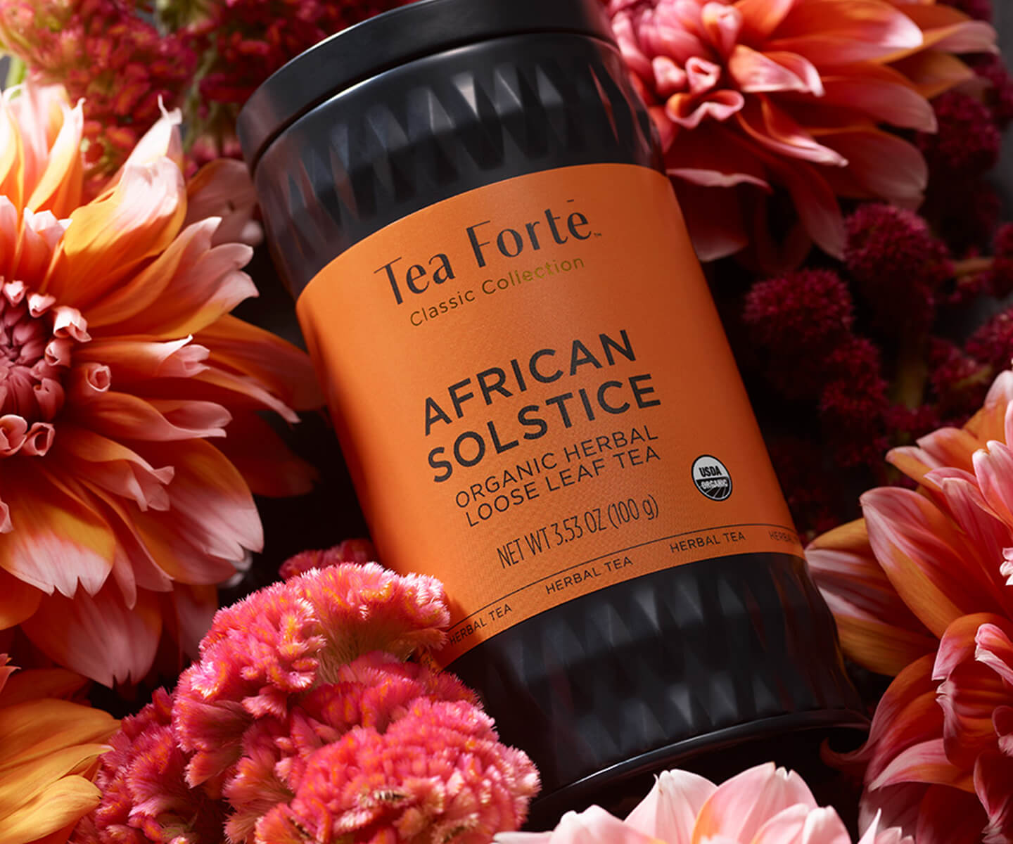 African Solstice Loose Tea Canister on a bed of flowers