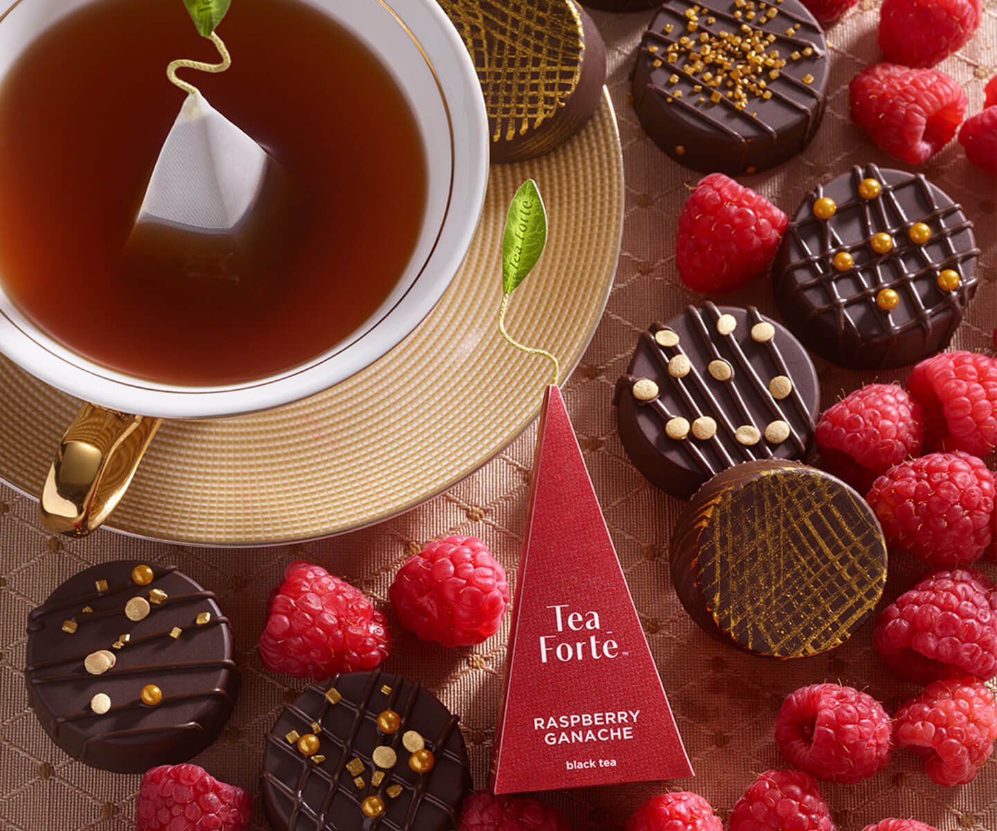 Tea Forté pyramid infuser with chocolates.