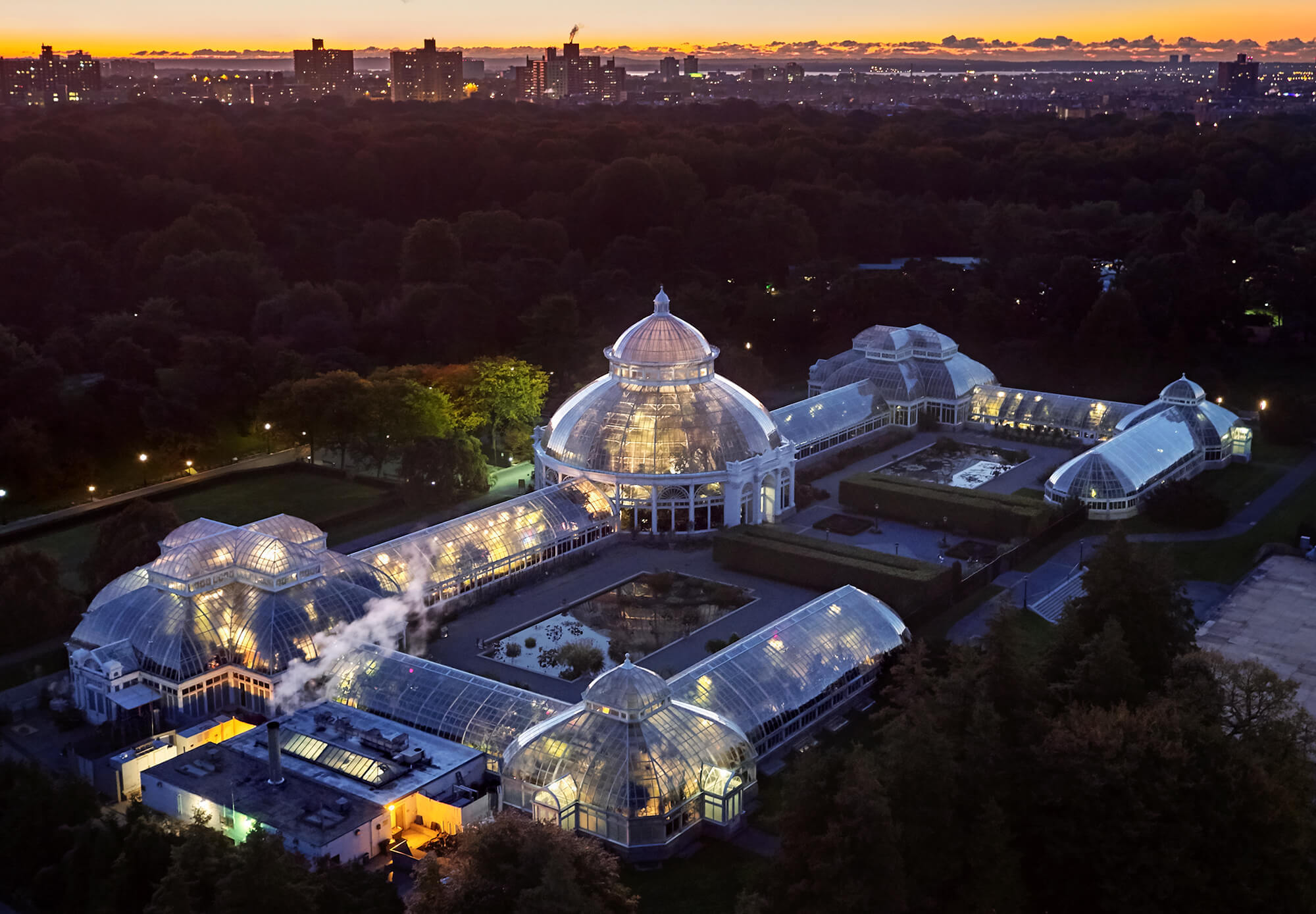 The Enid A. Haupt Conservatory at The New York Botanical Garden seen at sunset from above