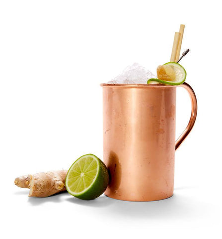Turmeric Tantra Mule Mocktail with lime half and ginger root