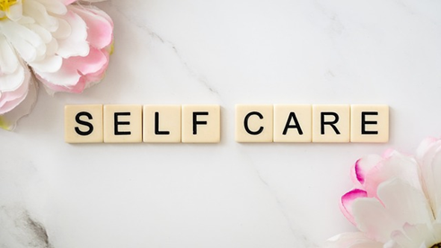 Assembled letters of the word self-care.