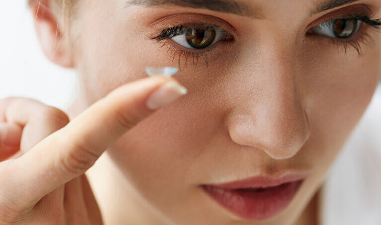 Woman Putting On Contacts