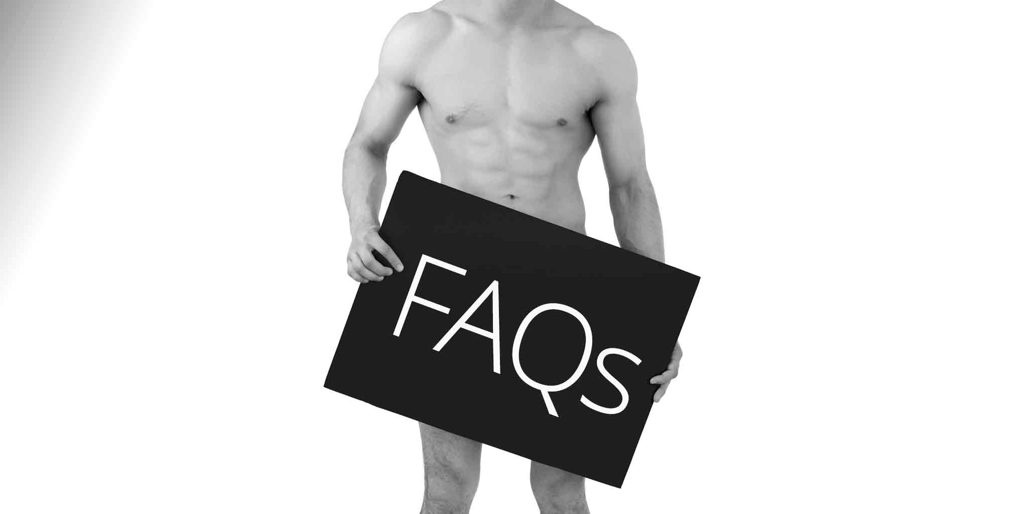 Black and white image of a shirtless man with a toned body, holding a large sign in front of him that reads 'FAQs' in bold letters. The sign covers his lower body, symbolizing the frequently asked questions regarding men's Brazilian waxing services.