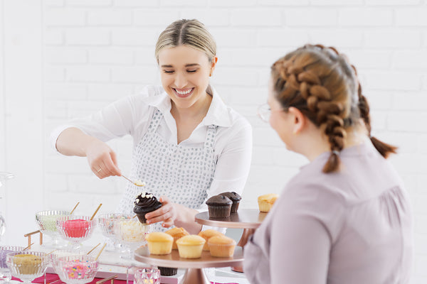 Cupcake Bartender serves guest custom cupcake at event in Austin, Texas